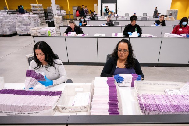 In this Oct. 29, 2024, file photo, workers check for signatures on ballots at the L.A. County ballot processing center in the city of Industry. (Photo by David Crane, Los Angeles Daily News/SCNG)